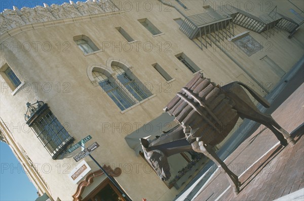 USA, New Mexico, Santa Fe, Sculture of laden mule in Burro Alley