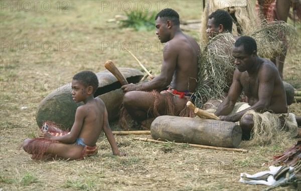 PACIFIC ISLANDS, Melanesia, Vanuatu Islands, "Efate Island.  Port Vila.  Men from Pentecost Island playing traditional tamtams, slit drums hollowed from trees at a Melanesian cultural festival."