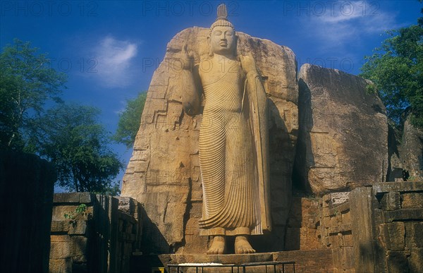SRI LANKA, Aukana, Twelve metre high standing Buddha believed to have been sculpted during the reign of Dhatusena in the 5th century AD.