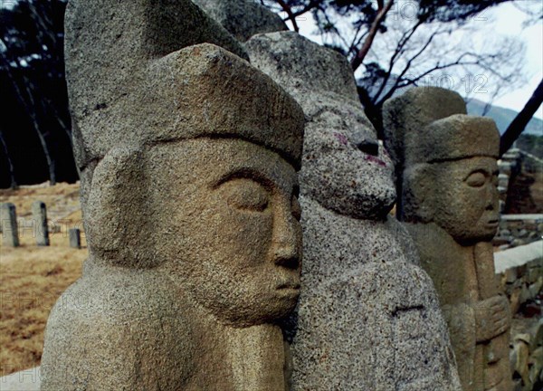 SOUTH KOREA, Tongdosa, Carved Guardian Stones standing in a row at the Buddhist Temple