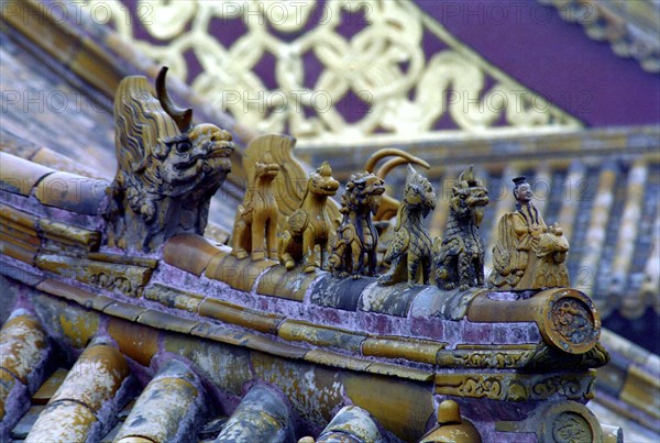 CHINA, Shandong, Qufu, Close up of decorative roof carvings in the ancient grounds where Confucius practiced