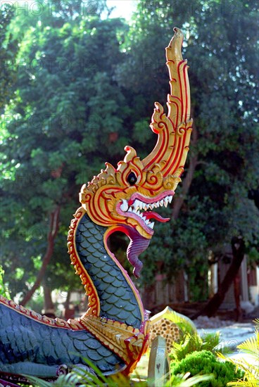 LAOS, Savannakhet, Wat Sainyamungkhun. Detail of Guardian statue in the form of a dragon used to keep evil spirits away