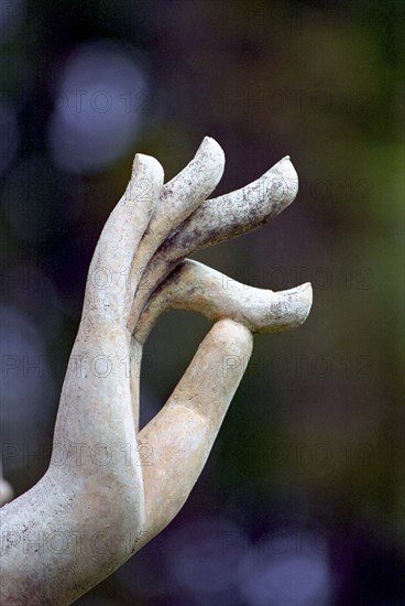 THAILAND, Sukhothai, Close up statue detail of Buddhas hand in classic pose refered to as Vitarka