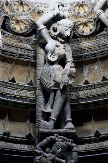 INDIA, Rajasthan, Mt Abu, Decorative carved marble figure at one of the Dilwara Temples