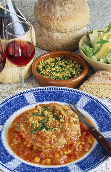 ITALY, Food and Drink, "Ossobucco, a dish of braised shin of veal served with bread salad and red wine."