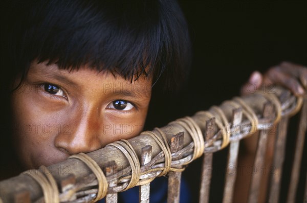 COLOMBIA, Amazonas, Santa Isabel, "Camilla, a Macuna Indian girl at the gate of her maloca. "