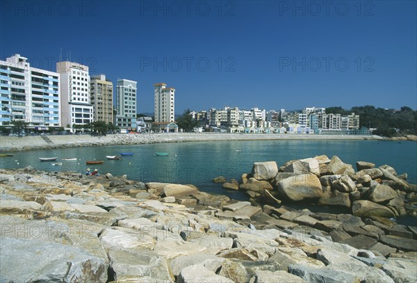 HONG KONG, Stanley, View over the beach with high res apartment buildings along shore