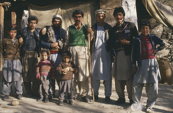 PAKISTAN, North West Frontier, Chitral, Group portrait of men and boys of Chitral family.