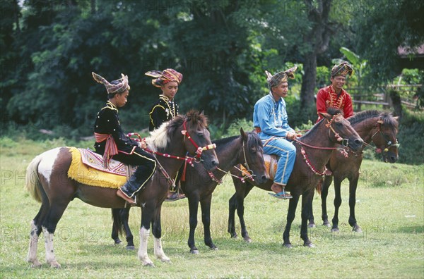 BORNEO, Sabah, Kota Belud, Bajau Dayak horsemen at Tamu or open air market.