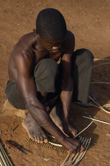 CENTRAL AFRICAN REPUBLIC, People, Sango tribesman making fishing traps with twigs and reeds