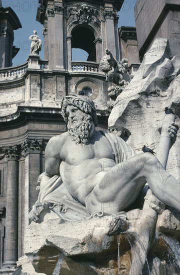 ITALY, Lazio, Rome, Piazza Navona.  Fontana dei Fiumi.  Detail of fountain depicting figures representing the four great rivers of the world by Bernini.