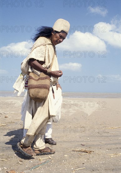 COLOMBIA, Arhuaco de la Sierra Nevada, Kogi Mama or Holy Man searching for shells