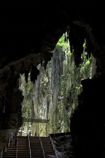 MALAYSIA, Near Kuala Lumpur, Batu Caves, View of cave mouth outline with steps in the foreground