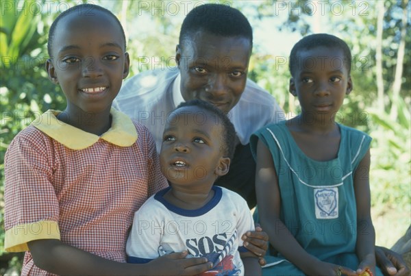 UGANDA, Kampala, Portrait of single parent family group.