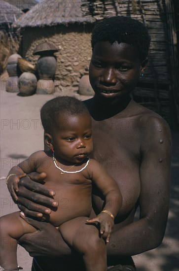 NIGERIA, Bauchi State, Zull, Portrait of young woman and child from village on road between Jos and Bauchi.