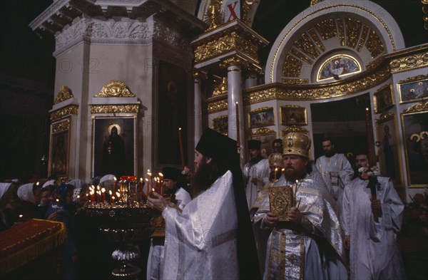 RUSSIA, Moscow`, St Daniil Monastery Orthodox priests in procession in front of the altar at Easter mass