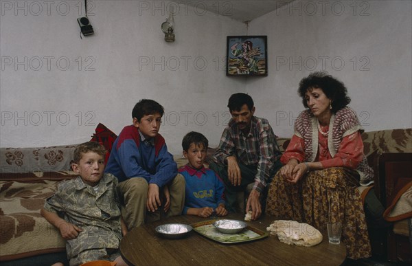 SERBIA, and MONTENEGRO, Kosovo, Poor Albanian family living on bread and cheese