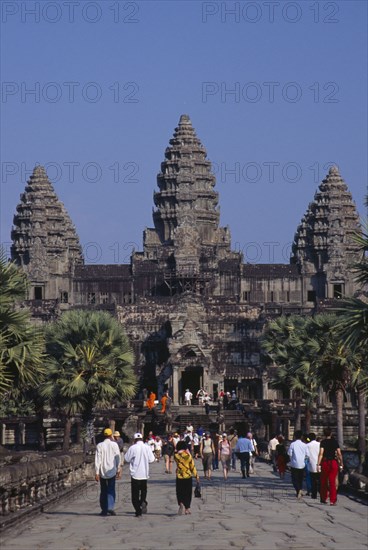 CAMBODIA, Siem Reap, Angkor Wat, The causeway leading to the central complex with  tourist crowds at Chinese New Year