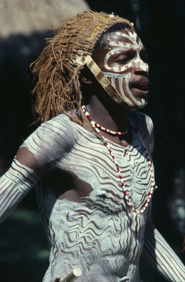 KENYA, Tribal People, Kikuyu tribesman wearing head dress and white body paint.