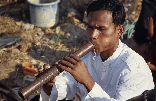 CAMBODIA, Siem Reap, Angkor Wat, Traditional Khmer flautist accompanying shaman ceremony