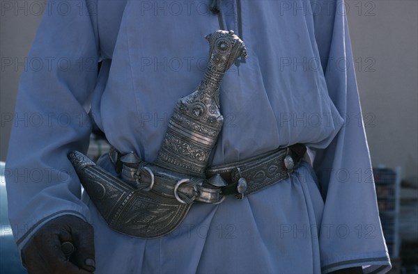 OMAN, General, Detail of traditional silver curved dagger or khanjar worn at the waist by Omani men.