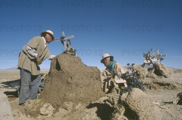 BOLIVIA, Oruro, Chipaya, People attending graves during Day of the Dead on November 2nd.