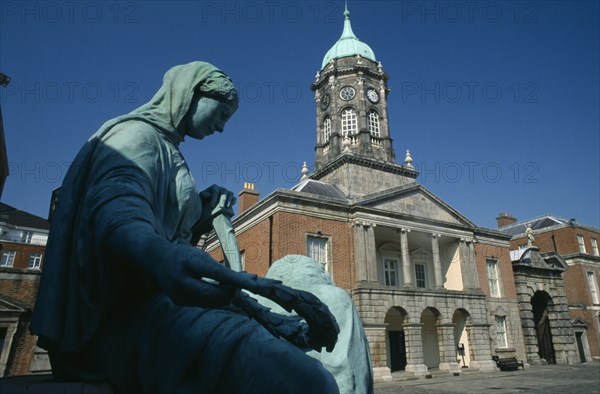 IRELAND, County Dublin, Dublin, Dublin Castle upper yard and side view of the Genealogical Office and Bedford Tower with statue in the foreground