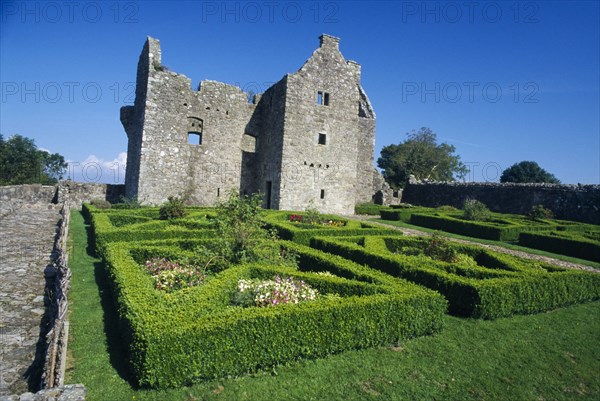 NORTHERN IRELAND, Fermanagh, Tully, Tully Castle. Ruins of a fortified plantation house dating from 1610 with recently planted early 17th century style formal garden
