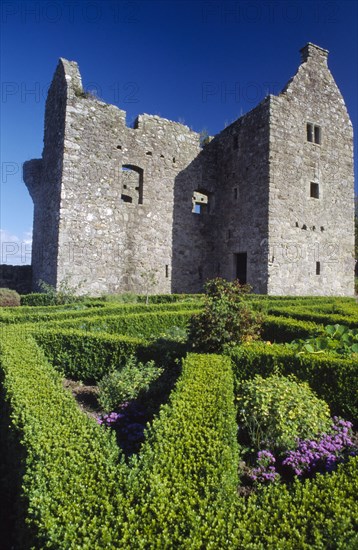 NORTHERN IRELAND, Fermanagh, Tully, Tully Castle. Ruins of a fortified plantation house dating from 1610 with recently planted early 17th century style formal garden