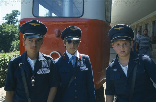 HUNGARY, Budapest, Three Hungarian boys in Pioneers railway uniform.