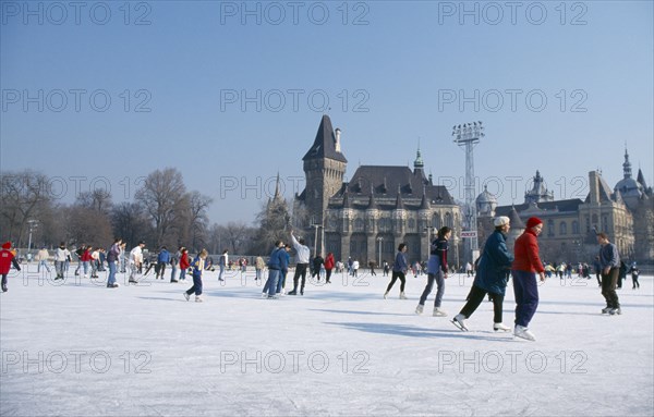 HUNGARY, Budapest, Ice skaters on outdoor rink.