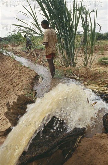 SOMALIA, Bula Hawa, Local men and irrigation channel in project to restart agriculture in area devastated by war near Mandera funded by Trocaire.