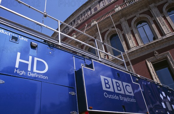 20059180 ENGLAND  London Kensington. The Royal Albert Hall. Part view of the exterior with a blue BBC Outside Broadcast truck in front.