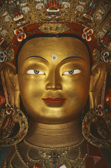 INDIA, Ladakh, General, Golden face of Buddha.  Tibetan Buddhism is practised in this area of Northern India.