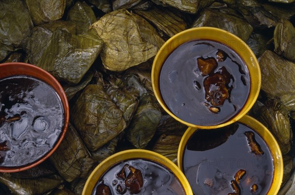 MEXICO, Juchitan, Tamales and bowls of chocolate and chilli sauce.