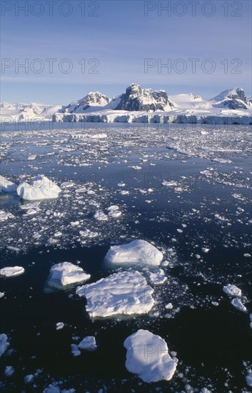 ANTARCTICA, Peninsula Region, Sunset over ice flow in the Gullet.