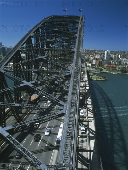 AUSTRALIA, New South Wales, Sydney, Sydney Harbour Bridge seen from Pylon Lookout with people on Bridge Climb below