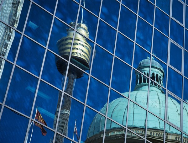 AUSTRALIA, New South Wales, Sydney, Reflection of the dome of the Queen Victoria building and the AMP / Sydney Tower seen in glass building