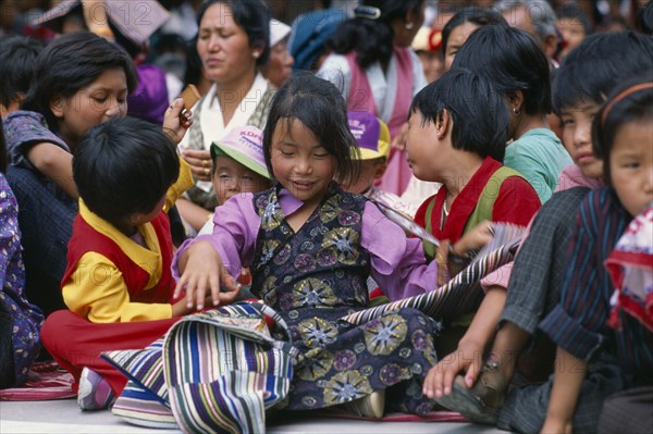 INDIA, Himachal Pradesh, Dharamsala, Tibetan children celebrating the birthday of the Dalai Lama.