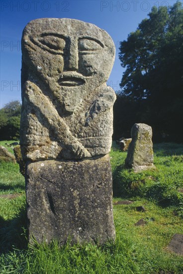 IRELAND, Fermanagh, Boa Island, One of two double faced pre christian figures that stand in Caldragh cemetery