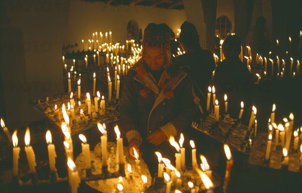 PERU, Cusco, Vilcanota Mountains, Ice Festival of Qoyllur Riti. Pre Columbian in origin but of Christian significance today. Worshippers at candlemass ceremony.