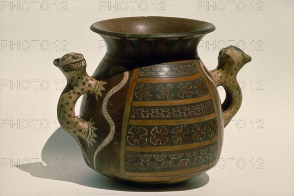 PERU, Archaeology, Inca ceremonial ceramic vessel with handles carved in the form of jaguars.
