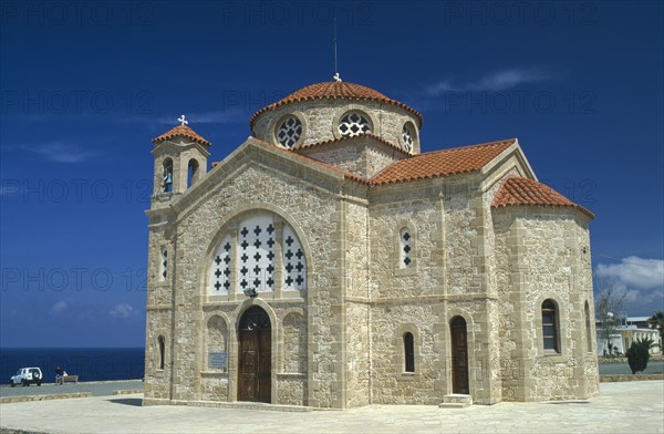 CYPRUS, Cape Drepanon, Agios Georgiou church exterior with tiled roof and bell tower.