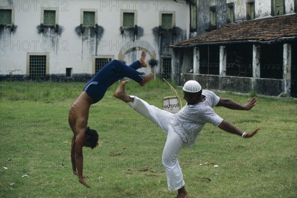 BRAZIL, Sport, Capoeira, Traditional African derived martial arts form performed to the sound of the berimbau one stringed bow and resonator and accompanying chant.