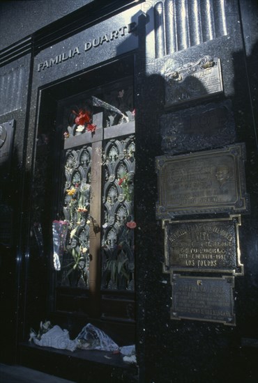 ARGENTINA, Buenos Aires, Cemetery of the Recoleta.  Eva Perons tomb in the Duarte family mausoleum decorated with flowers.
