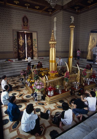 THAILAND, South, Bangkok, Wat Meuang the City pillar the most important animist shrine in Bangkok with devotees making offerings