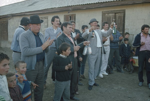 RUSSIA, Daghestan, Lak Region, Guests at wedding feast.