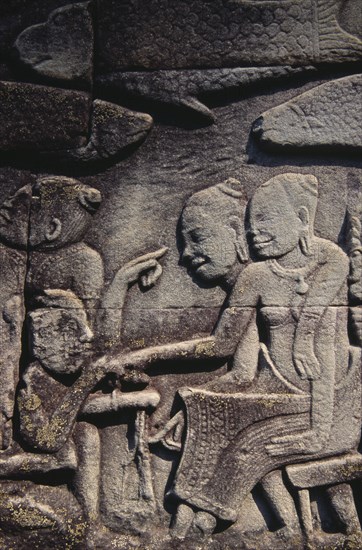CAMBODIA, Siem Reap Province, Angkor Thom, The Bayon.  Bas relief carvings on the south wall depicting everyday scenes.  Fishmarket.