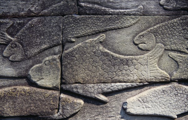 CAMBODIA, Siem Reap Province, Angkor Thom, The Bayon.  Bas relief carvings on the south wall depicting everyday scenes.  Fishmarket.