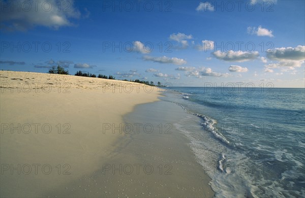 SEYCHELLES, Bird Island, Shoreline of quiet sandy beach.